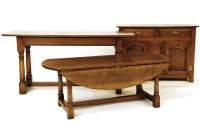 Lot 551 - Titchmarsh and Godwin - An oval oak drop flap coffee table