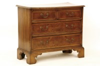 Lot 515 - An old reproduction three drawer chest