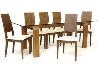 Lot 539 - A walnut dining room suite by Heals