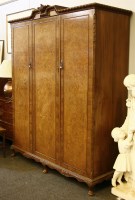 Lot 517 - A walnut two door wardrobe