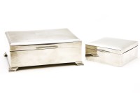 Lot 184 - A silver and cedar lined engine turned desk top cigarette box