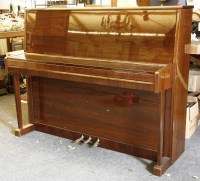 Lot 519 - A Scholze model 98974 walnut cased iron framed upright cottage type piano