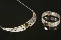 Lot 705 - A sterling silver and smokey quartz 'Celtic Serpent' necklace and bangle suite