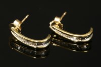 Lot 729 - A pair of 9ct gold diamond set earrings in the form of cuffs