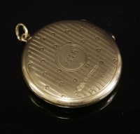 Lot 123 - An Edwardian 9ct gold circular hinged locket