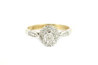 Lot 25 - An 18ct gold illusion set diamond cluster ring