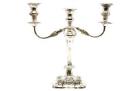 Lot 199 - A silver three branch candelabra