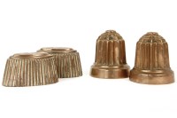 Lot 204 - A pair of early 19th century reeded jelly moulds