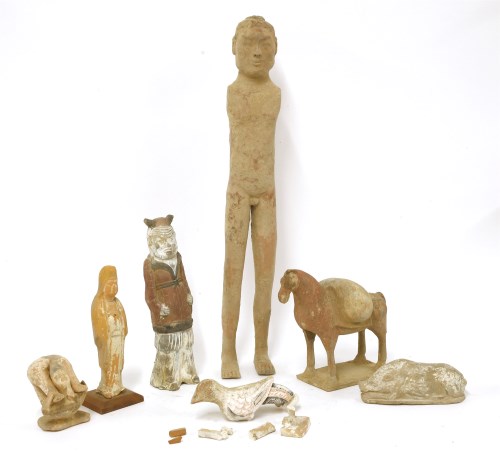 Lot 1029 - A collection of pottery tomb figures