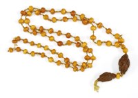 Lot 1286 - A Chinese single row of amber prayer beads