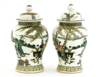 Lot 1150 - A pair of Chinese famille verte jars and covers