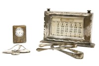 Lot 101 - Silver items: a desk calendar