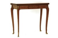 Lot 616 - A Continental Louis XVI style marquetry inlaid and gilt metal mounted fold over card table