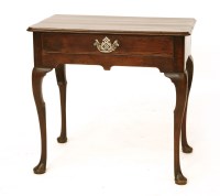 Lot 592 - An 18th century walnut(?) single drawer side table