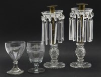 Lot 312 - A pair of 19th century glass and brass lustre drop candlesticks