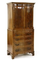 Lot 677 - A Georgian style serpentine fronted tall boy with two cupboard doors over brushing slide with drawers beneath and on bracket feet