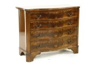 Lot 669 - A Georgian style mahogany serpentine fronted chest of four graduated drawers and on bracket