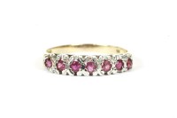 Lot 200 - A 9ct gold round cut ruby half eternity ring