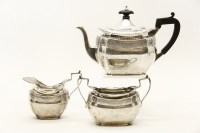 Lot 397 - A silver three piece tea set