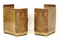 Lot 680 - A pair of Art Deco walnut bedside cabinets