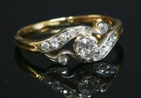 Lot 177 - An Art Nouveau single stone diamond ring with diamond set shoulders