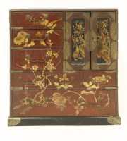 Lot 1557 - A Japanese lacquered table top cabinet