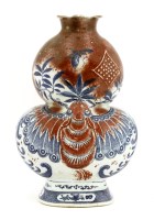 Lot 1104 - A Chinese blue and white and underglaze copper red vase