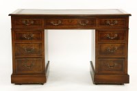 Lot 960 - A walnut pedestal desk