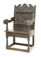 Lot 903 - A carved oak chair
