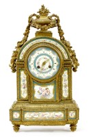 Lot 865 - A French ormolu and porcelain mantel clock