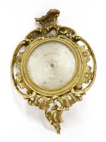 Lot 888 - A Negretti and Zambra carved and giltwood cartel barometer