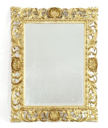 Lot 1004 - A Florentine carved giltwood mirror