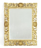 Lot 1004 - A Florentine carved giltwood mirror