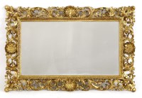 Lot 1005 - A Florentine carved giltwood wall mirror