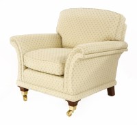 Lot 1019 - A modern cream-upholstered armchair