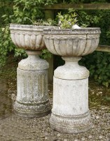 Lot 942 - A pair of reconstituted garden urns