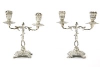 Lot 400 - A pair of Egyptian silver twin branch candelabra