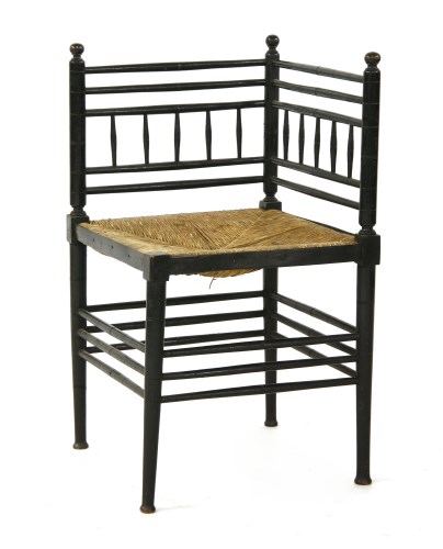 Lot 7 - An Aesthetic ebonised corner chair
