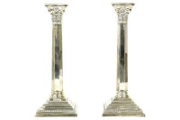 Lot 394 - A pair of silver candlesticks