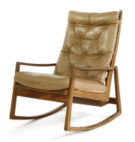 Lot 435 - A teak rocking chair