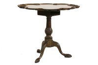 Lot 989 - A George III style mahogany tripod/supper table