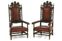 Lot 1147 - A pair of Victorian carved oak throne chairs