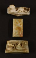 Lot 1180 - A set of three Chinese jade sword sections