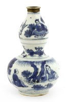 Lot 1061 - A Chinese blue and white double gourd vase