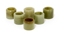 Lot 1544 - A collection of six Chinese jade archer's rings