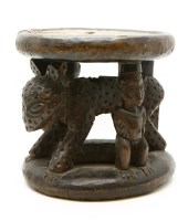 Lot 755 - An African carved stool