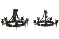 Lot 1093 - A pair of five light wrought iron chandeliers