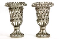 Lot 1047 - A pair of decorative metal urns
