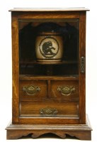 Lot 728 - A late Victorian smokers cabinet with Doulton tobacco jar
