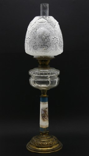 Lot 784 - A 19th century oil lamp with porcelain column